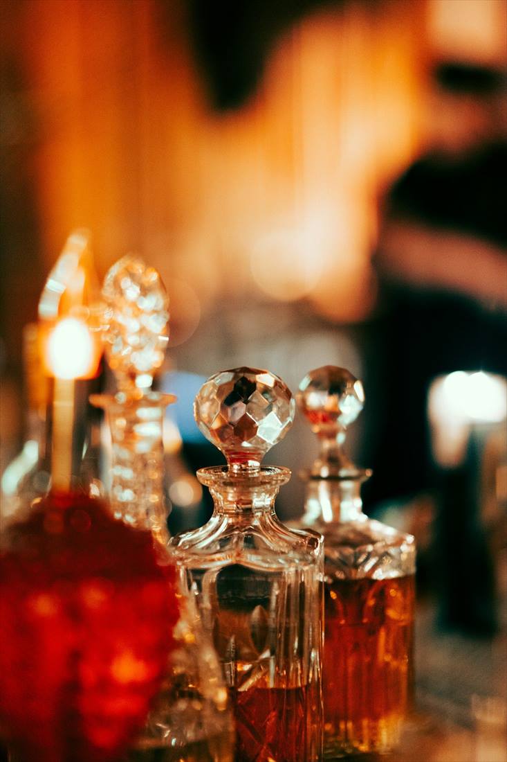 Crystal attar bottles in warm light