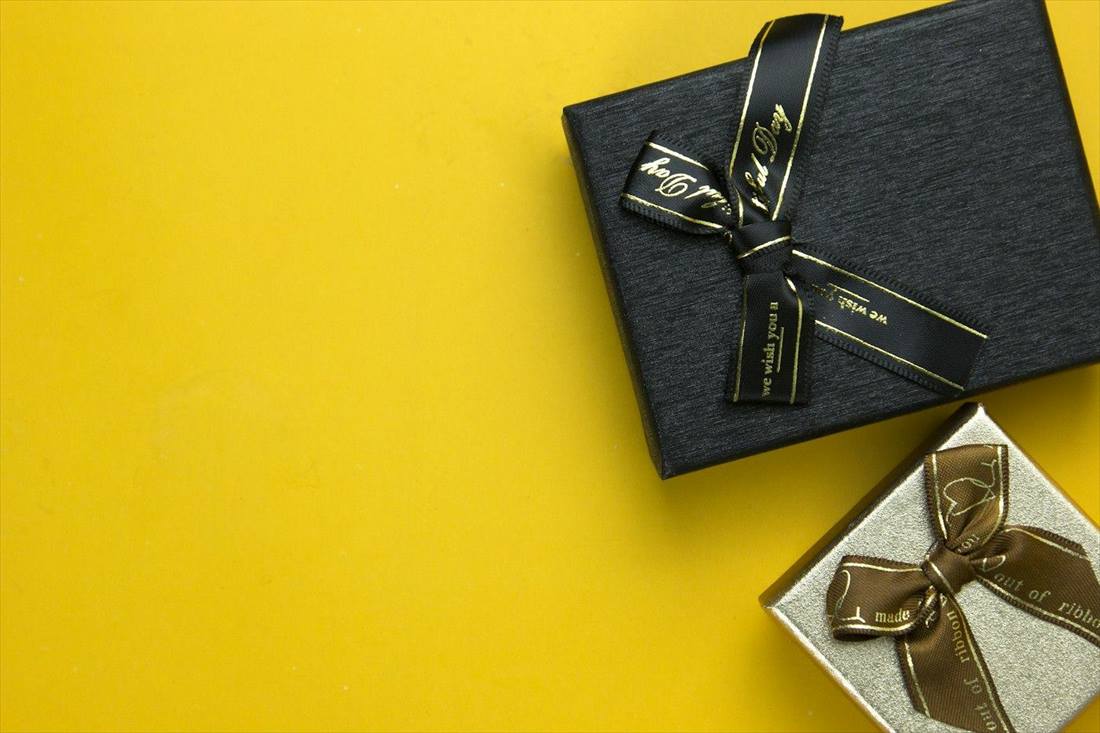 Black gift box with gold ribbon