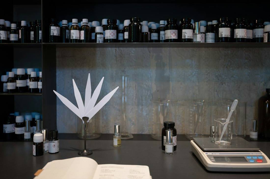 Perfumer's workbench with scale, smelling strips and essences